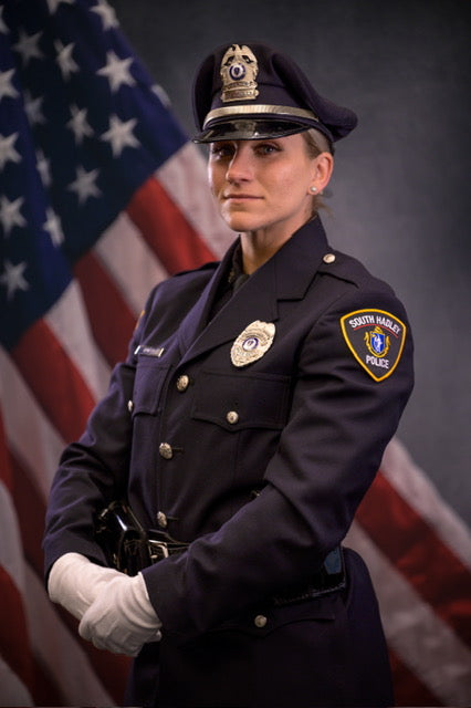 Kelsey Owner and Founder of Pearl and Company in Police Uniform